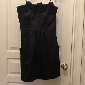 Strapless black satin dress with pockets